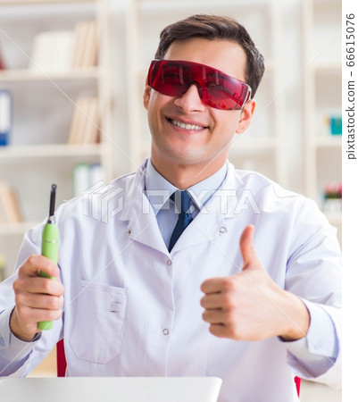 Young dentist working in the dentistry hospital Young dentist working in the dentistry hospital 66615076