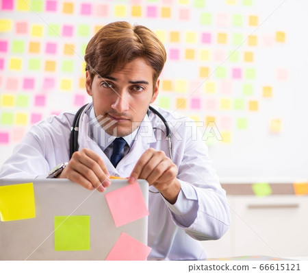 Male doctor with many conflicting prioritites 66615121