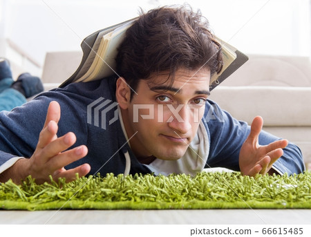 Handsome student working at startup project at home Handsome student working at startup project at home 66615485