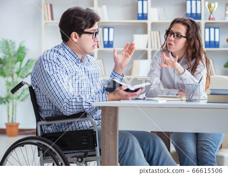 Disabled student studying and preparing for college exams 66615506