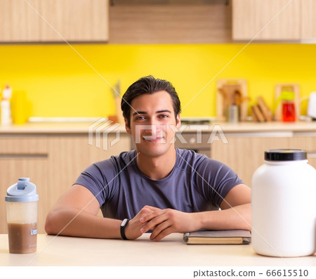 Young man blogging about food supplements 66615510