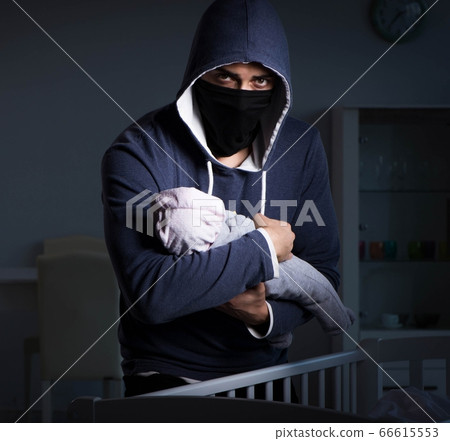 Criminal stealing baby in human child traficking concept Criminal stealing baby in human child traficking concept 66615553
