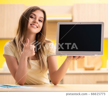 Woman blogger presenting on her laptop Woman blogger presenting on her laptop 66615773