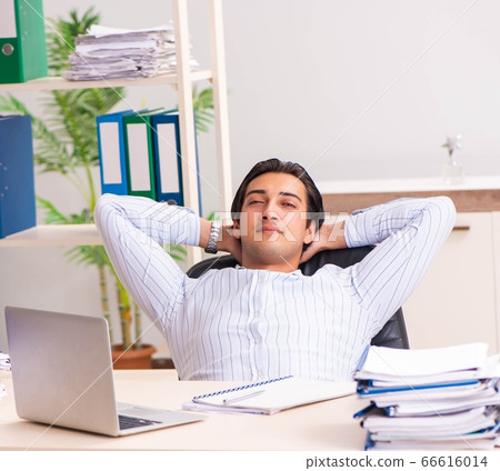 Young employee sitting at the office 66616014