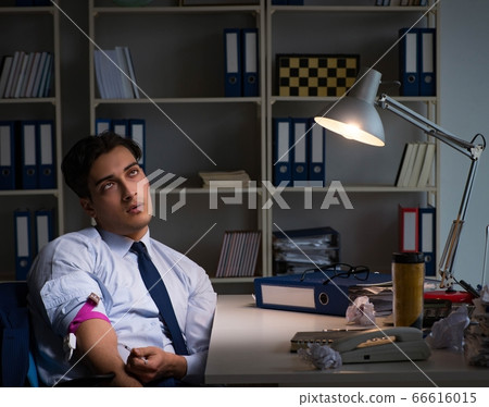 Employee relieving stress from overtime with drugs narcotics 66616015