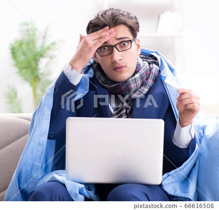 Sick businessman working from home due to flu sickness Sick businessman working from home due to flu sickness 66616508
