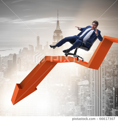 Businessman sliding down on chair in economic crisis concept 66617307