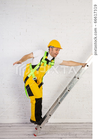 Irresponsible use of a ladder during construction Irresponsible use of a ladder during construction 66617319