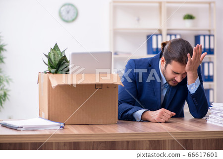 Young man being fired from his work Young man being fired from his work 66617601