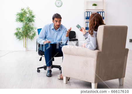 Pregnant woman visiting young male psychologist Pregnant woman visiting young male psychologist 66617610