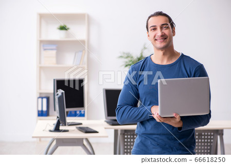 Young male it specialist working in the office 66618250