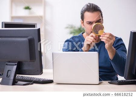 Young male it specialist working in the office Young male it specialist working in the office 66618252