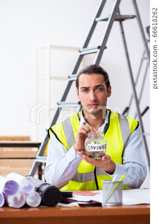 Young male architect working indoors 66618262