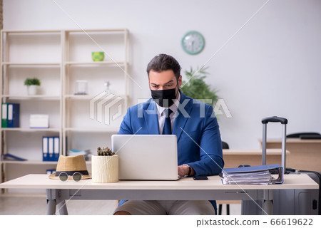Businessman preparing for trip during pandemic 66619622