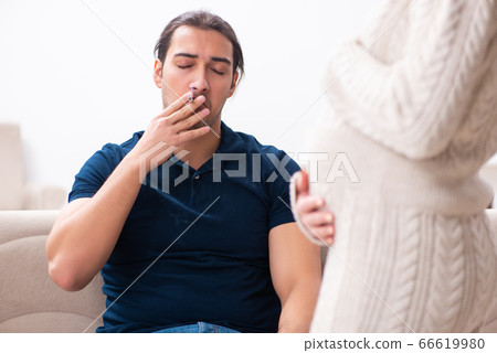 Man and pregnant woman in antismoking concept 66619980