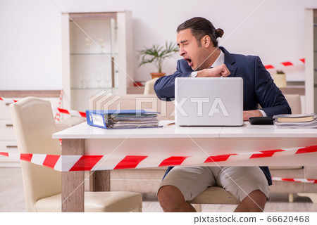 Young male employee working at home during pandemic disease Young male employee working at home during pandemic disease 66620468