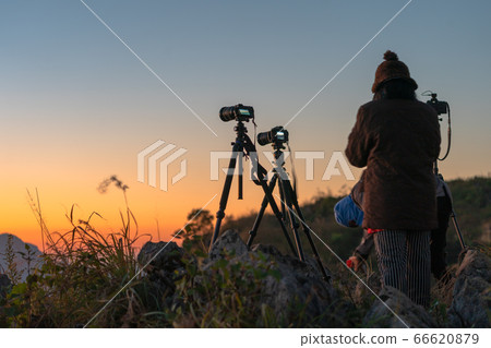 cameras set up at sunrise. 66620879