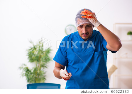Young male doctor surgeon in fatal negligence concept Young male doctor surgeon in fatal negligence concept 66622583
