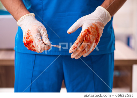 Young male doctor surgeon in fatal negligence concept Young male doctor surgeon in fatal negligence concept 66622585