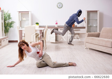 Gangster and young woman in robbery concept 66622680