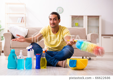 Young male contractor doing housework at home Young male contractor doing housework at home 66622686