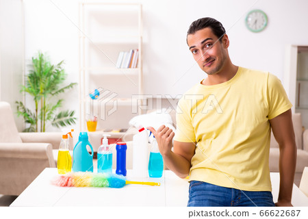 Young male contractor doing housework at home Young male contractor doing housework at home 66622687