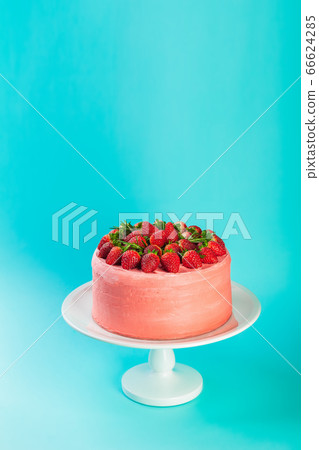 Pink strawberry mascarpone cake with fresh berries and rosemary 66624285
