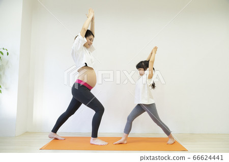Parent and child doing stretching Parent and child doing stretching 66624441