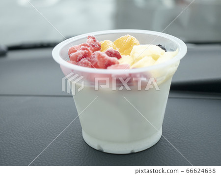 Condensed fruit shaved ice on the car dashboard Condensed fruit shaved ice on the car dashboard 66624638