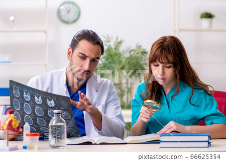 Two doctors colleagues working in the hospital 66625354