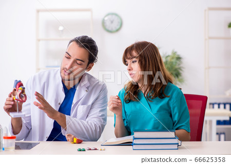 Two doctors colleagues working in the hospital 66625358