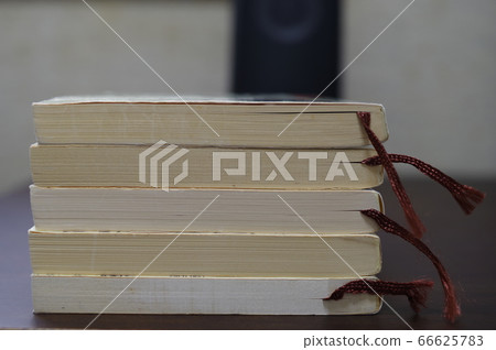 A reading book on the desk 66625783