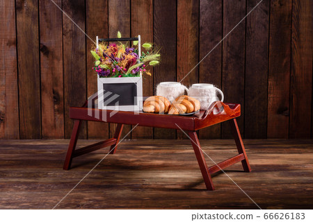 Delicious breakfast with fresh croissants and ripe 66626183