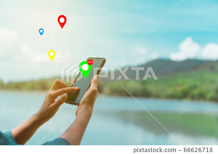 People use smartphone to check map to travel with People use smartphone to check map to travel with 66626718