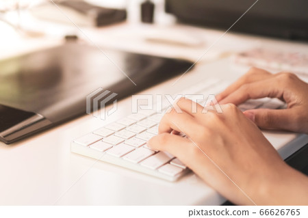 Woman hand using laptop to work study on work desk 66626765