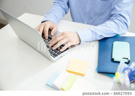 Hand of a man working from home Hand of a man working from home 66627093