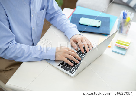 Hand of a man working from home Hand of a man working from home 66627094