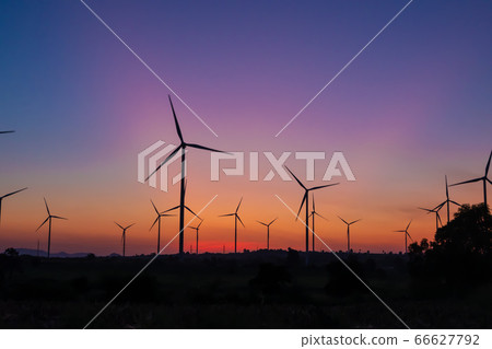 Beautiful wind turbine on the field in sunset time background 66627792