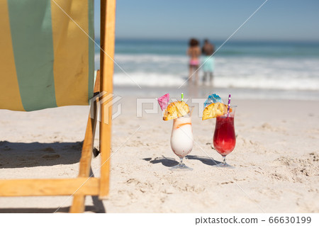 Cocktails glasses on the beach Cocktails glasses on the beach 66630199