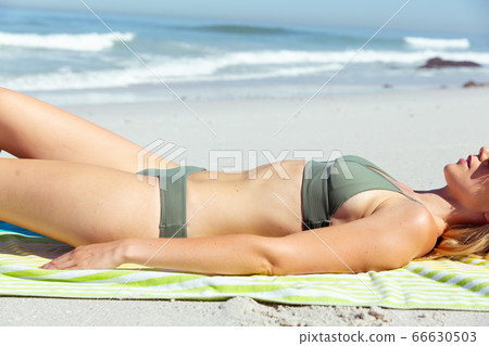 Caucasian woman enjoying at beach Caucasian woman enjoying at beach 66630503