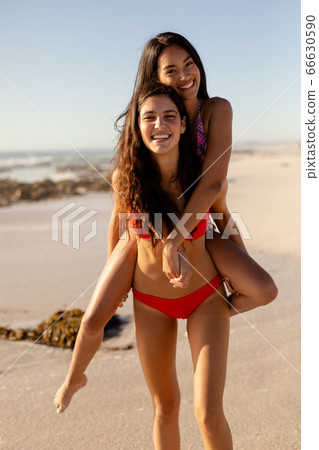 Caucasian women having fun on the beach Caucasian women having fun on the beach 66630590
