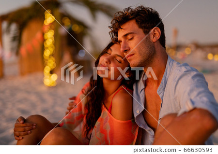 Multi-ethnic group of male and female dancing with firework stick Multi-ethnic group of male and female dancing with firework stick 66630593