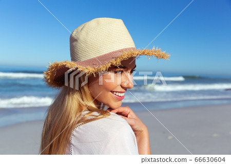 Caucasian woman enjoying at beach Caucasian woman enjoying at beach 66630604
