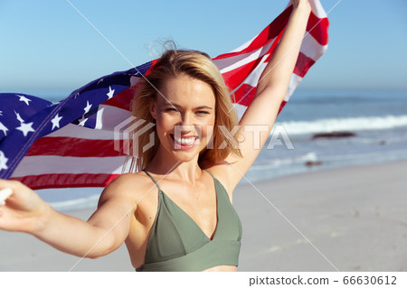 Caucasian woman enjoying at beach Caucasian woman enjoying at beach 66630612