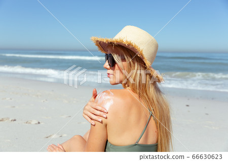 Caucasian woman enjoying at beach Caucasian woman enjoying at beach 66630623