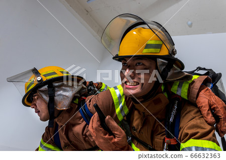 Asian male and female firefighter portrait, young smiling fireman in uniform 473 66632363