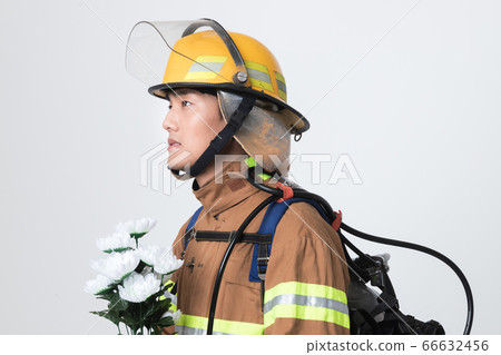 Asian male and female firefighter portrait, young smiling fireman in uniform 402 66632456