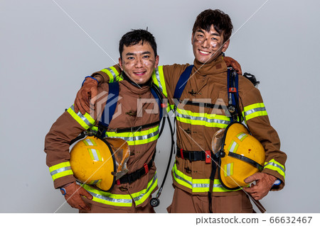 Asian male and female firefighter portrait, young smiling fireman in uniform 519 66632467