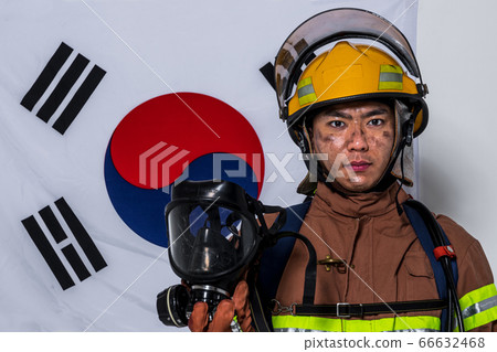 Asian male and female firefighter portrait, young smiling fireman in uniform 497 Asian male and female firefighter portrait, young smiling fireman in uniform 497 66632468