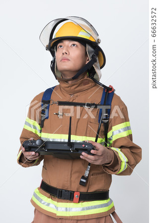 Asian male and female firefighter portrait, young smiling fireman in uniform 432 66632572
